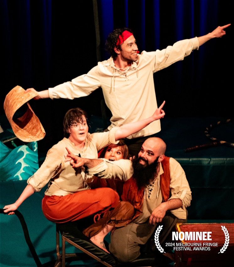 4 people are crowded together pointing in different directions with big happy faces. they are all wearing earthy pirate costumes. the background is dark and there is an award in the bottom corner.