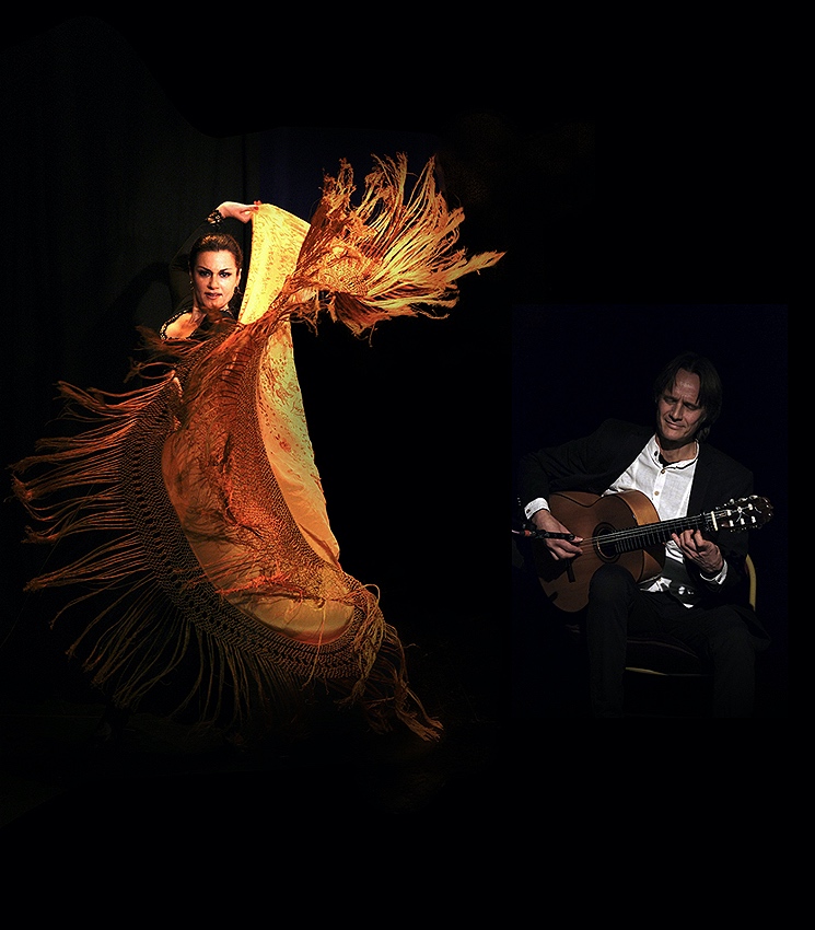 A flamenco dancer in a golden shawl dances left while a guitarist in a suit plays music right.