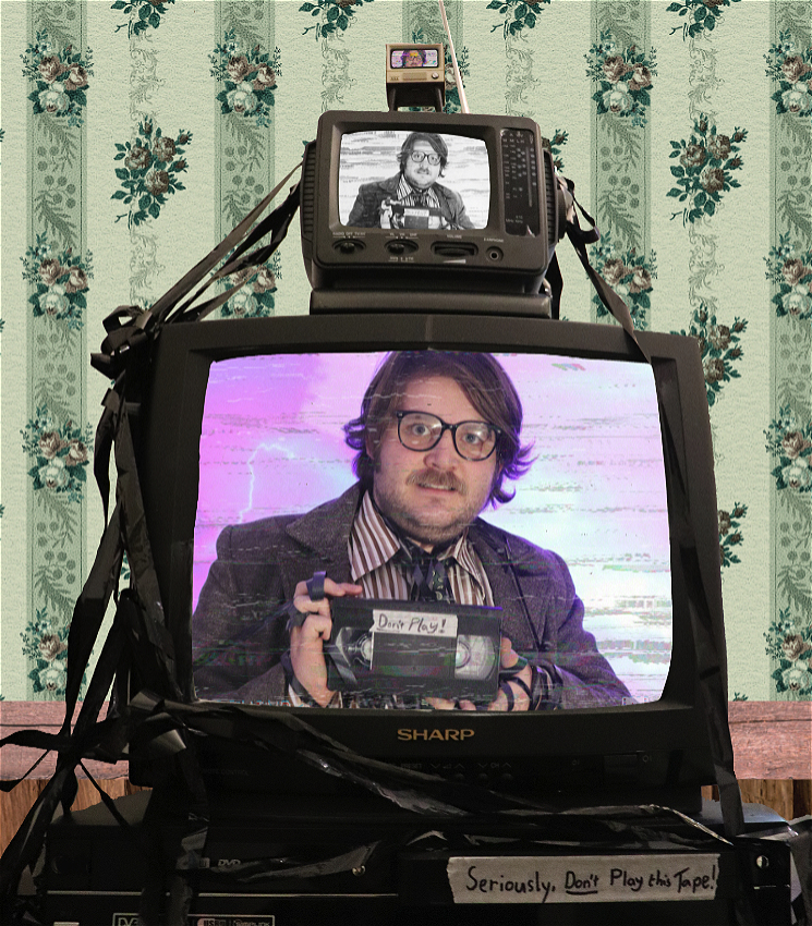 3 different size TV stacked on top of a VCR.<br>Each TV screen has the same image of a man in a suit and glasses holding a tape with the words "do not play" on it. The image quality is different on each TV, with one in black and white.<br>The VCR has a tape in label "seriously, don't play this tape!"